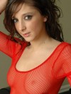 Melanie is showing off her perky tits in a mesh dress