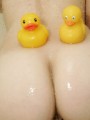 Emma has a shower with lots of bubbles and her rubber ducks