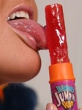 Pigtailed Alyssa shows off her oral skills sucking on a lollipop!