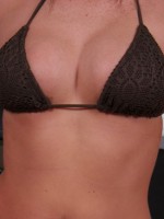 Alyssas huge perky boobs are barely covered by her tiny bikini top