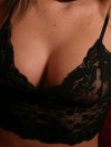Alyssa Roxis huge tits are barely covered by her black lace top