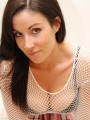 Krissy shows off her amazing tight body in a sexy fishnet top and short skirt