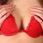 Free Porn Gallery Watch as Ruby pushes her perky perfect tits together in a sexy red bra