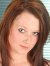 Cute redhead strips out of her sexy red bra and panties